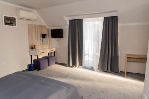 Postel nebo postele na pokoji v ubytování Complex Turistic Monaco