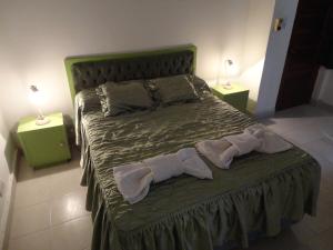 Postel nebo postele na pokoji v ubytování Valle De Las Sierras Hotel