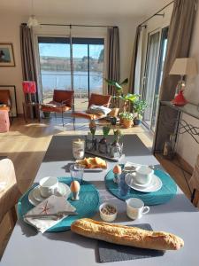 a table with plates of food on top of it at maison caroline bairon in Le Chesne