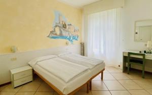 Postel nebo postele na pokoji v ubytování Hotel Ideal + 37 fotografií