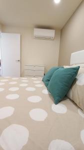 a bedroom with a bed with a polka dot floor at Appartamento Las Americas aria condizionata wi-fi in Arona