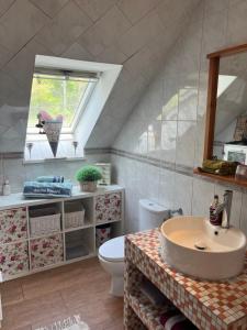 a bathroom with a sink and a toilet at Sweet Little Home Mimi in Berlin +29 photos