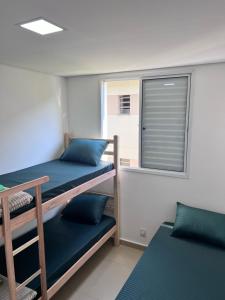 Krevet ili kreveti na sprat u jedinici u okviru objekta Santa Rosa hospedagem