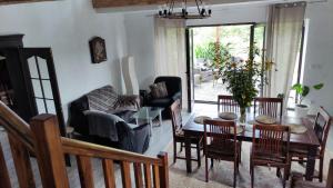 a living room with a table and chairs at Siedlisko Barnabówka in Wydminy