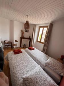 Postel nebo postele na pokoji v ubytování Bien et toit