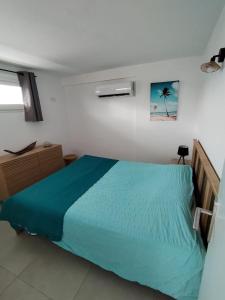 Postel nebo postele na pokoji v ubytování Résidence La Palmeraie + 19 fotografií