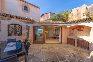 an external view of a house with a patio at Villa Ilda in Cannigione +38 photos