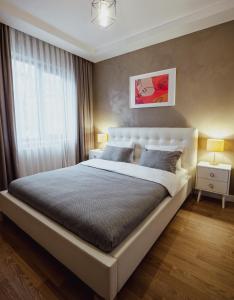 a bedroom with a large bed and a window at Uraya Suites in Istanbul