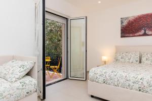 Postel nebo postele na pokoji v ubytování Villa Harmony Sorrento + 37 fotografií