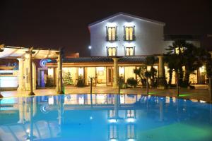 a villa with a swimming pool at night at Villa Masseria Marini in San Giuseppe Vesuviano