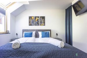 Voodi või voodid majutusasutuse Wichrowe Wzgórza, MyWeek toas