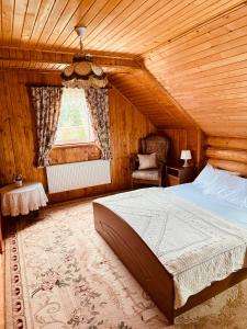 A bed or beds in a room at Cottage Kalinka