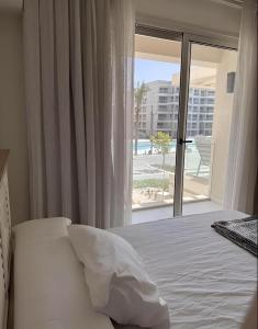A bed or beds in a room at Marassi north coast