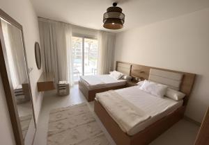 A bed or beds in a room at Marassi north coast