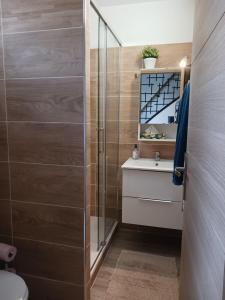 a bathroom with a shower and a toilet and a sink at Casa Littoral in Le Grau-dʼAgde