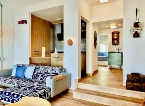 a living room with a couch and a living room with at My Space on the Beach, Luxury Apartment in Casares