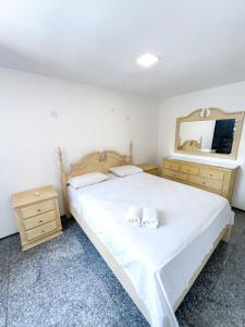 Ένα ή περισσότερα κρεβάτια σε δωμάτιο στο Flat atlantico 201