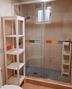 a bathroom with a shower with a glass door at Apartamento Daniella Nerja in Nerja