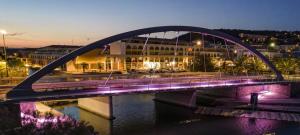 a bridge over a river in a city at night at Sète climatisé 200 m plage parking in Sète