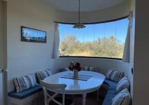a living room with a table and a window at Masseria Le Celline in Nardò +77 photos