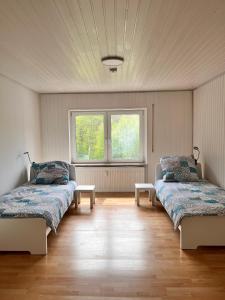 Postel nebo postele na pokoji v ubytování Alte Mühle - Ferienwohnung Tamara