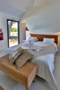 Un pat sau paturi într-o cameră la Sublime Tahiti Beach Retreat