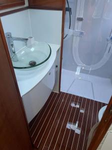 a bathroom with a sink and a shower at Gestione Mare Diving & Charter in Siracusa
