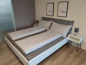 Кровать или кровати в номере Kleine Auszeit - 2-Zimmer Ferienwohnung