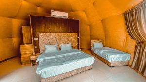 Ένα ή περισσότερα κρεβάτια σε δωμάτιο στο Mahmmad Luxury Camp