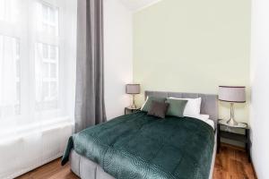 Posteľ alebo postele v izbe v ubytovaní Brzozowa Apartments by Hostly