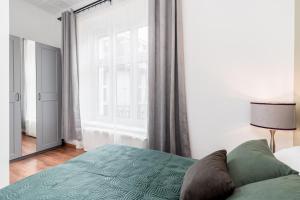 Posteľ alebo postele v izbe v ubytovaní Brzozowa Apartments by Hostly