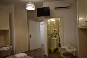 Koupelna v ubytování DomuS al Corso con servizio B&B + 158 fotografií