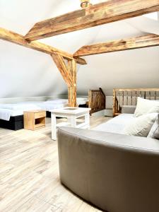 a bedroom with two beds and a couch at Zielona Mila in Sępólno Krajeńskie +67 photos