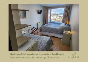 a hotel room with two beds and a window at Hostería Aonikenk in Ushuaia
