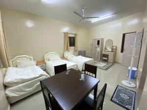 Postel nebo postele na pokoji v ubytování SABKHA Apartment