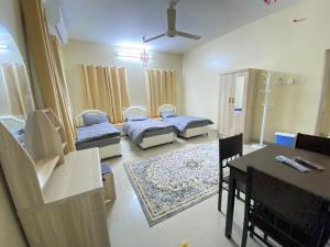 Postel nebo postele na pokoji v ubytování SABKHA Apartment