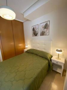 Postel nebo postele na pokoji v ubytování Gestiona2R - Apartamento con gran terraza y piscina