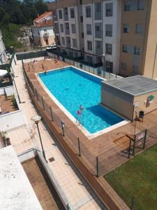Bazén v ubytování Gestiona2R - Apartamento con gran terraza y piscina nebo v jeho okolí