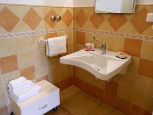 a bathroom with a sink and a toilet at Il Campanile B&B in Pisa +27 photos