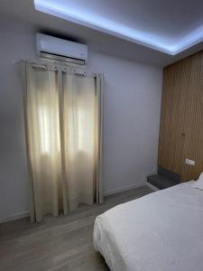 Postel nebo postele na pokoji v ubytování Suite Lithos + 9 fotografií