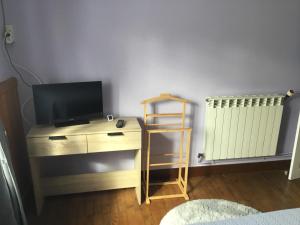 TV a/nebo společenská místnost v ubytování Logement avec parking max 7 personnes