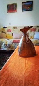 a brown bag sitting on top of a table at Sonja's House of Sun, Bislim Gorge, Riverview & yard in Kumanovo