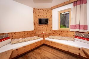 Televízia a/alebo spoločenská miestnosť v ubytovaní Alpen Chalet Wohnung "Martha"