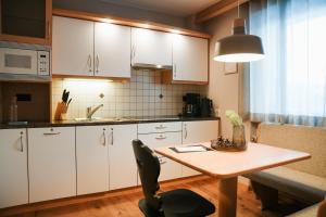Kuchyň nebo kuchyňský kout v ubytování Appartementhaus Arnika