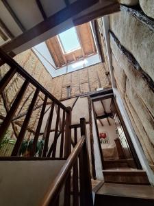 an overhead view of a staircase in a building with a window at Casa Rural El Encuentro in Villalón de Campos