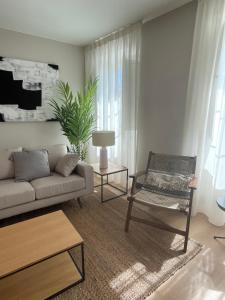 a living room with a couch and a chair at Santa Eulalia in Lugo