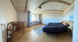 Ένα ή περισσότερα κρεβάτια σε δωμάτιο στο Gîte Les sources proche Annecy