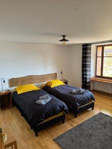 Ένα ή περισσότερα κρεβάτια σε δωμάτιο στο Gîte Les sources proche Annecy