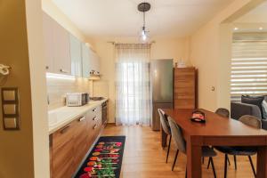 Kuchyň nebo kuchyňský kout v ubytování Harmony House + 30 fotografií