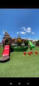 a playground with a slide and a slideintend at Apartamento Aconchego condomínio florida in Feira de Santana